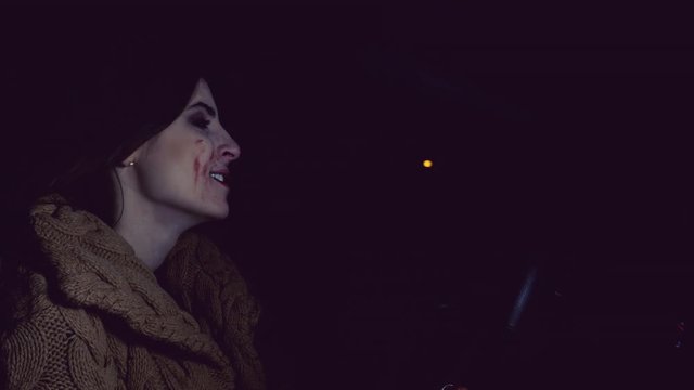 Female vampire driving car full of blood after killing