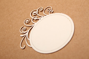 Round wooden frame with curls, for text