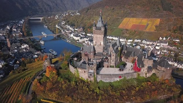 Flight over autumn Cochem castle, Mosel valley, Germany