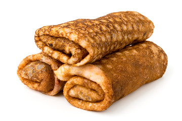 Three rolled pancakes on a white, close up..
