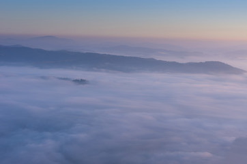 Fototapeta na wymiar Gradient morning horizon. Clouds in the mountains.