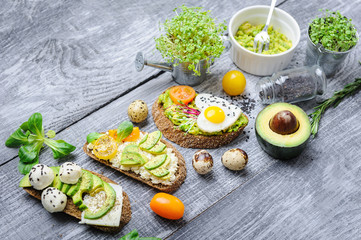 bruschetta with avocado microgrin, quail eggs and Adyghe cheese and mozzarella