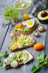 bruschetta with avocado microgrin, quail eggs and Adyghe cheese and mozzarella