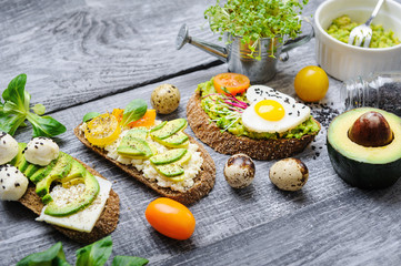 bruschetta with avocado microgrin, quail eggs and Adyghe cheese and mozzarella