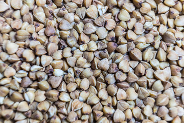Buckwheat von. Raw buckwheat grains close-up. Macro background.