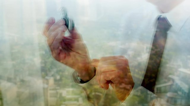 Reflection of a businessman playing with a fidget spinner
