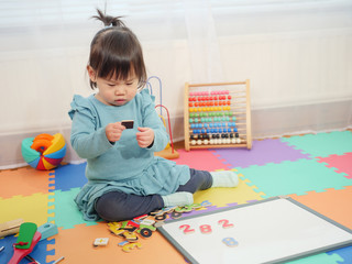 Baby girl learning math at home
