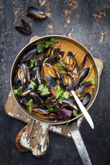Traditional French blue mussel in bouillabaisse as top view in a casserole