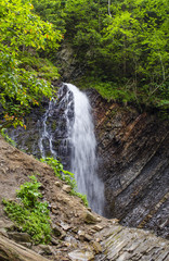 Fototapeta na wymiar small, beautiful waterfall in the Carpathians