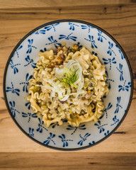 Pasta with fresh herbs, pine nuts and currants