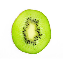 Green oval slice of kiwi fruit isolated on white background, top view
