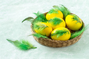 Colorful Easter eggs decorated with feathers