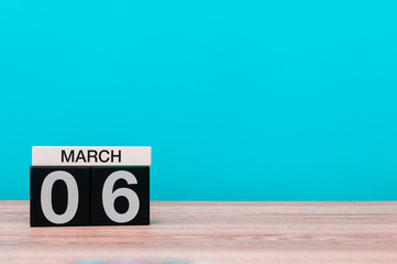 March 6th. Day 6 of march month, calendar on turquoise background. Spring time, empty space for text, mockup