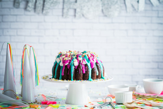 Colorful birthday cake on cake stand