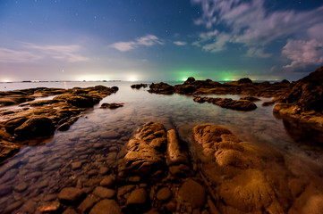 night photograph seascape. image may contain noise and soft focus due to long expose and high iso.