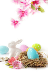 easter eggs and flowers isolated on white background