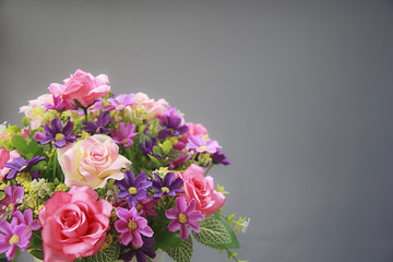 Pink rose bouquet isolated on gray background, soft focus