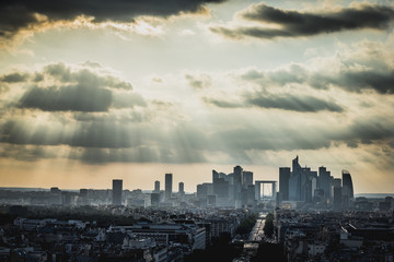 Aerial View on La Defense and its Skyscrapers in Paris, France. The rays of the sun through the clouds