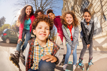 Teenagers with inline skates and skateboards