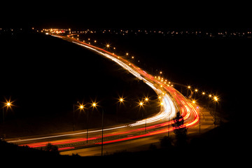 Fototapeta na wymiar Long exposure of cars on a nighttime highway