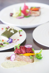 Three courses of elegant, creative restaurant meal - haute couture food concept