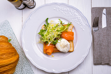 Toast with poached egg and salmon
