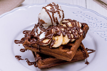 Chocolate waffle with banana and ice cream