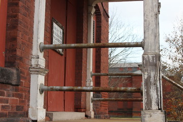 Old abandoned boarded up brick asylum hospital building