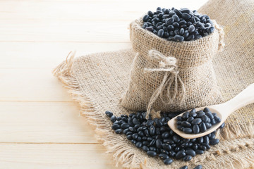 Obraz na płótnie Canvas black-beans in hemp sack