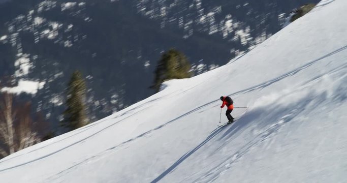 Pan left, skier in Gulmarg