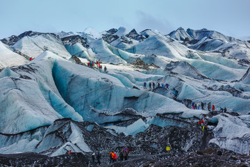 Private guide and group of hiker walking on glacier at Solheimajokull - 192246730