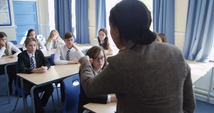 4K Angry teacher losing temper with disruptive pupil & sending him out of class