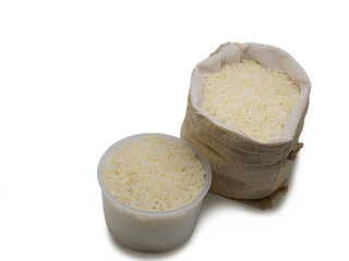 White rice in burlap sack bag.