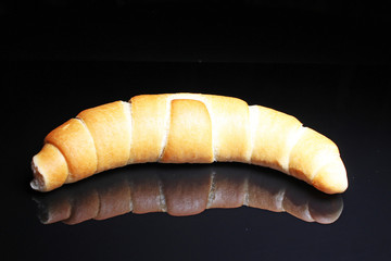 Whol mango on black reflective studio background. Isolated black shiny mirror mirrored background for every concept.