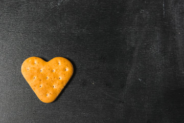 Heart cookies on a dark background. Love cookies. Heart in baking.