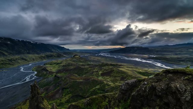 Dramatic evening over volcanic mountains in Iceland. Time lapse