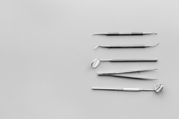 Dentist tools. Teethcare, dental health concept. Grey background top view copy space