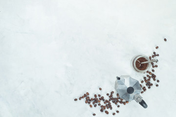 Geyser coffee maker with beans and ground coffee in a glass jar. High key drink photography from...