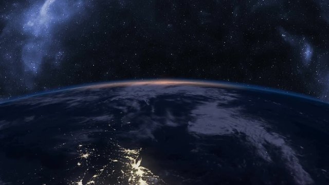Slow sunrise over Earth seen from Space, time-lapse, 4K
