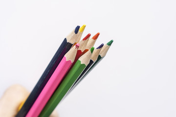 Bright colored pencils on a white background. Mocap