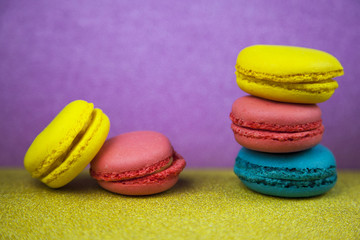 Macaroon. Macaron on violet background, different colors