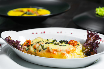 Dinner. Chef's specialty presented in restaurant on served table. Clouse up.