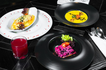 Set dinner of three courses. Chef's specialty presented in restaurant on served table. Clouse up.