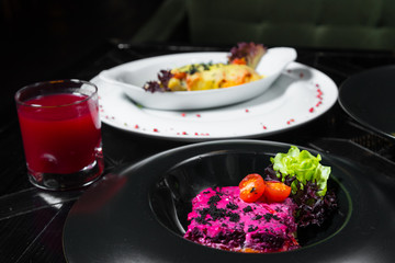 Set dinner of two courses. Chef's specialty presented in restaurant on served table. Clouse up.