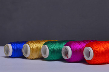 Colorful bobbins of thread background