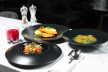 Set dinner of three courses. Chef's specialty presented in restaurant on served table. Clouse up.