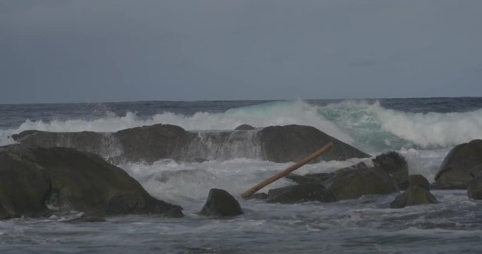 Aruba crashing waves on rocks before a hurricane