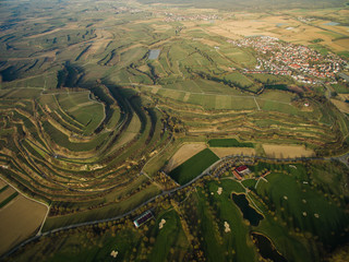 arial view of majestic landmark with green fields on tiers, Germany