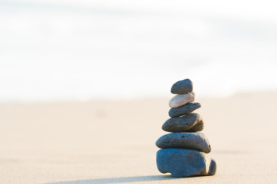 Zen stone little pile on sea beach