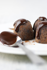 Chocolate truffles with chocolate sauce